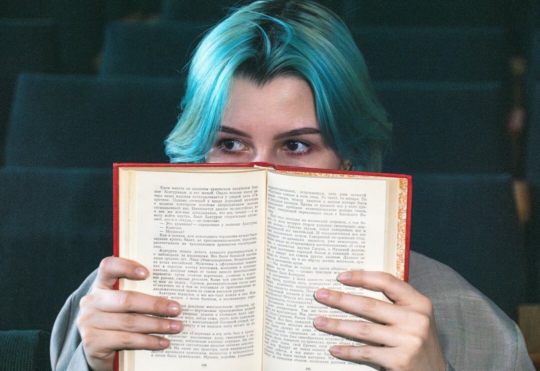 surprised reader with book